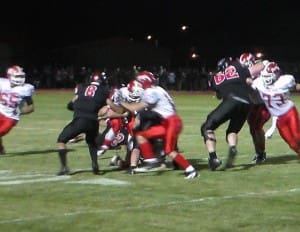 WR CHRIS ADAMO TRIES TO BREAK AWAY FROM A DEFENDER