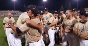 The Elks celebrate with Head Coach Trey Watts after the win.